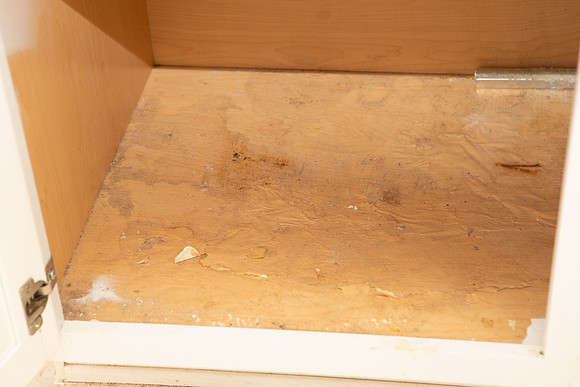 under sink in hall bath has water damage and is sinking in.